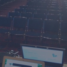 Chairs in a room with presentation table